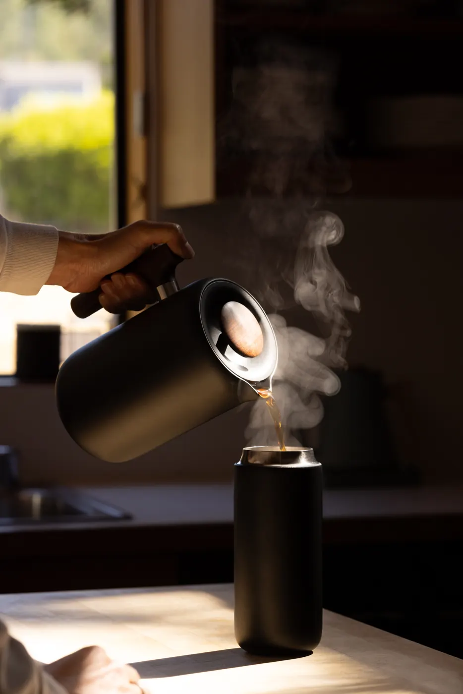 Fellow kettle pouring at the window